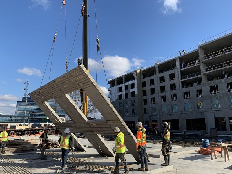 Engineers on site lifting part of building frame | Specialty Engineering | O'Donnell & Naccarato